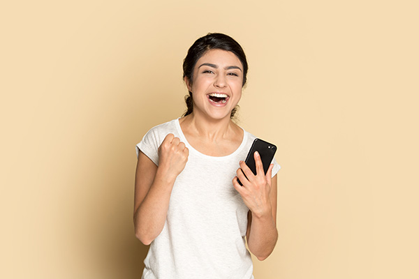 Couple smiling at phone